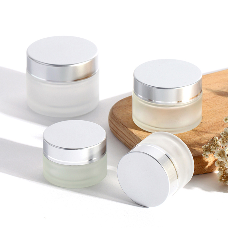 LOW MOQ Guangzhou Factory 1OZ 30g Empty Frosted Clear Silver Cap Cosmetics Glass Jar