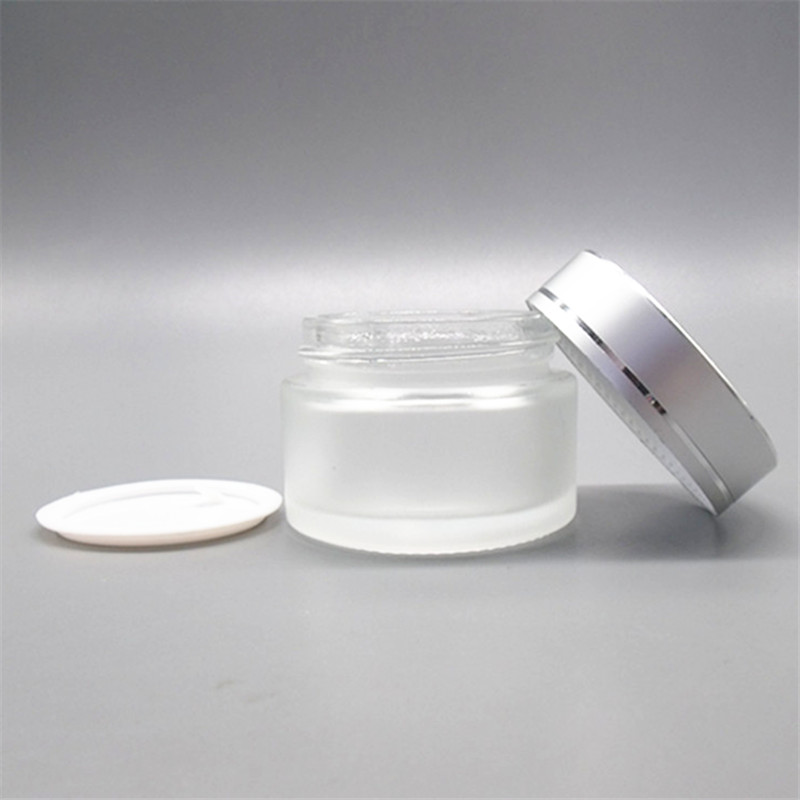 LOW MOQ Guangzhou Factory 1OZ 30g Empty Frosted Clear Silver Cap Cosmetics Glass Jar