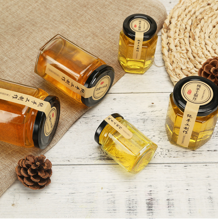 Label customized 380ml hexagon shape glass jars honey bottles