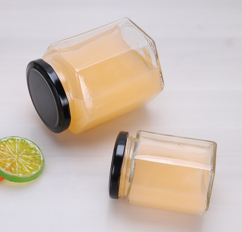 Label customized 380ml hexagon shape glass jars honey bottles
