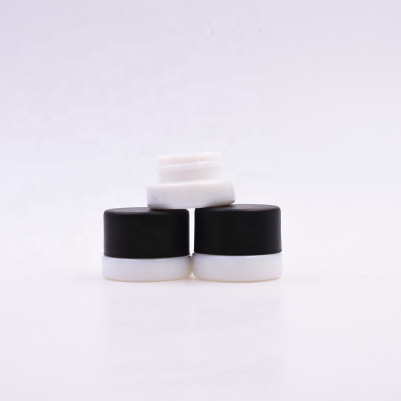 Lovely 3 ml white round small straight side eye cream cosmetic packing glass jar with black plastic child proof lid.