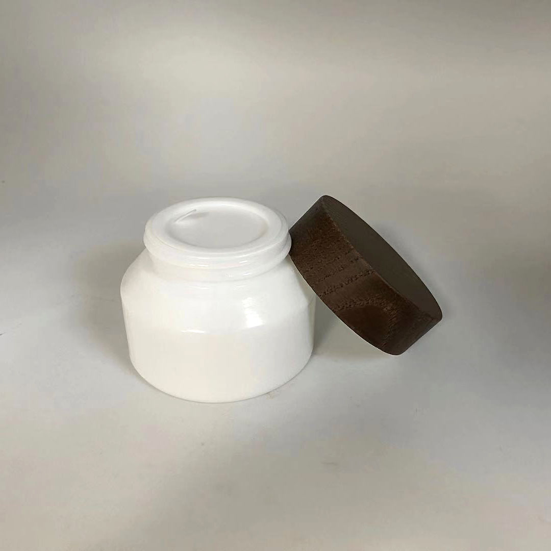 Low MOQ 15g 50g Empty cosmetic opal white porcelain sloping shoulder glass jar with wooden cap