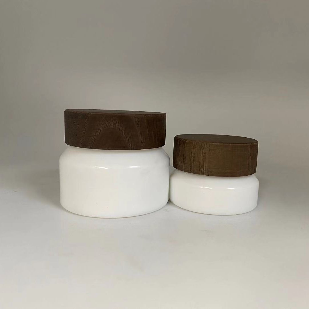 Low MOQ 15g 50g Empty cosmetic opal white porcelain sloping shoulder glass jar with wooden cap