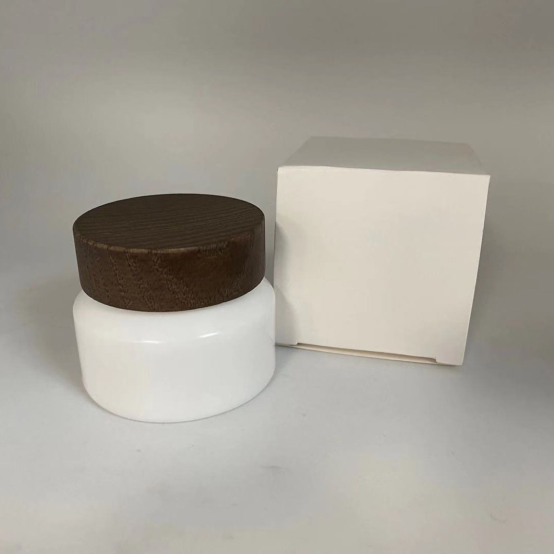 Low MOQ 15g 50g Empty cosmetic opal white porcelain sloping shoulder glass jar with wooden cap