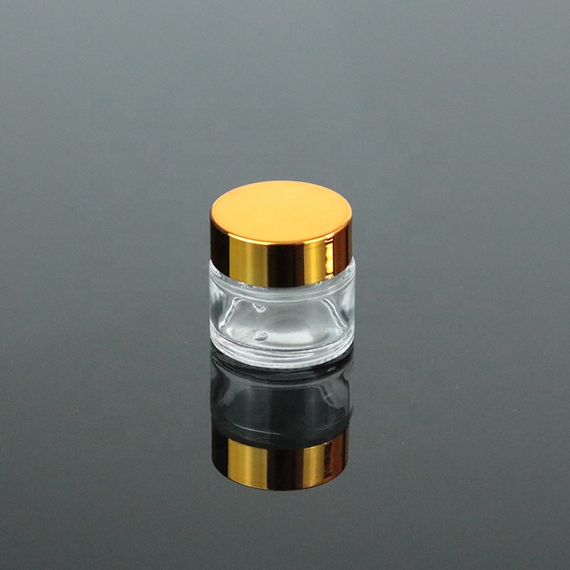Low MOQ Mini Clear Cream 10g 10ml Round Bottom Glass Jar With UV Gold Lid (GJM04)