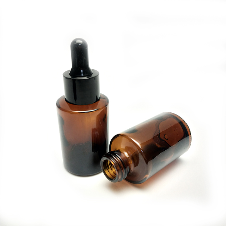 Low MOQ empty cosmetic clear amber glass serum glass dropper bottle 30ml