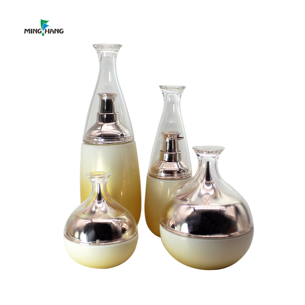 Luxury 50ml 100ml gold color skin care set luxury  pink black cosmetics jars with unique plastic lid