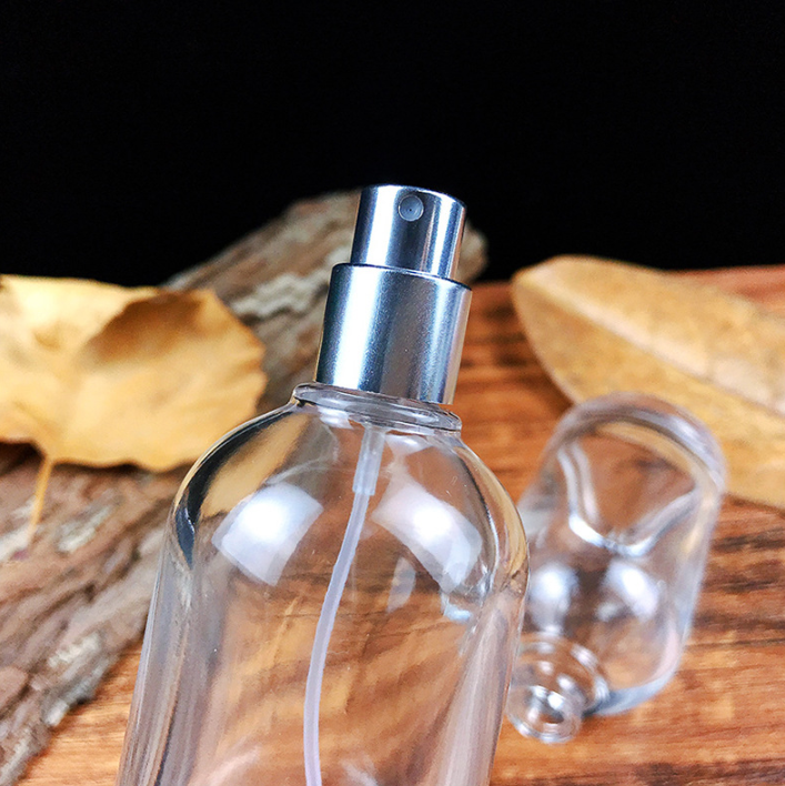 Luxury Mist Spray Pump Cap Transparent 50ml Round Glass Bottle Wholesale Empty Glass Perfume Bottle