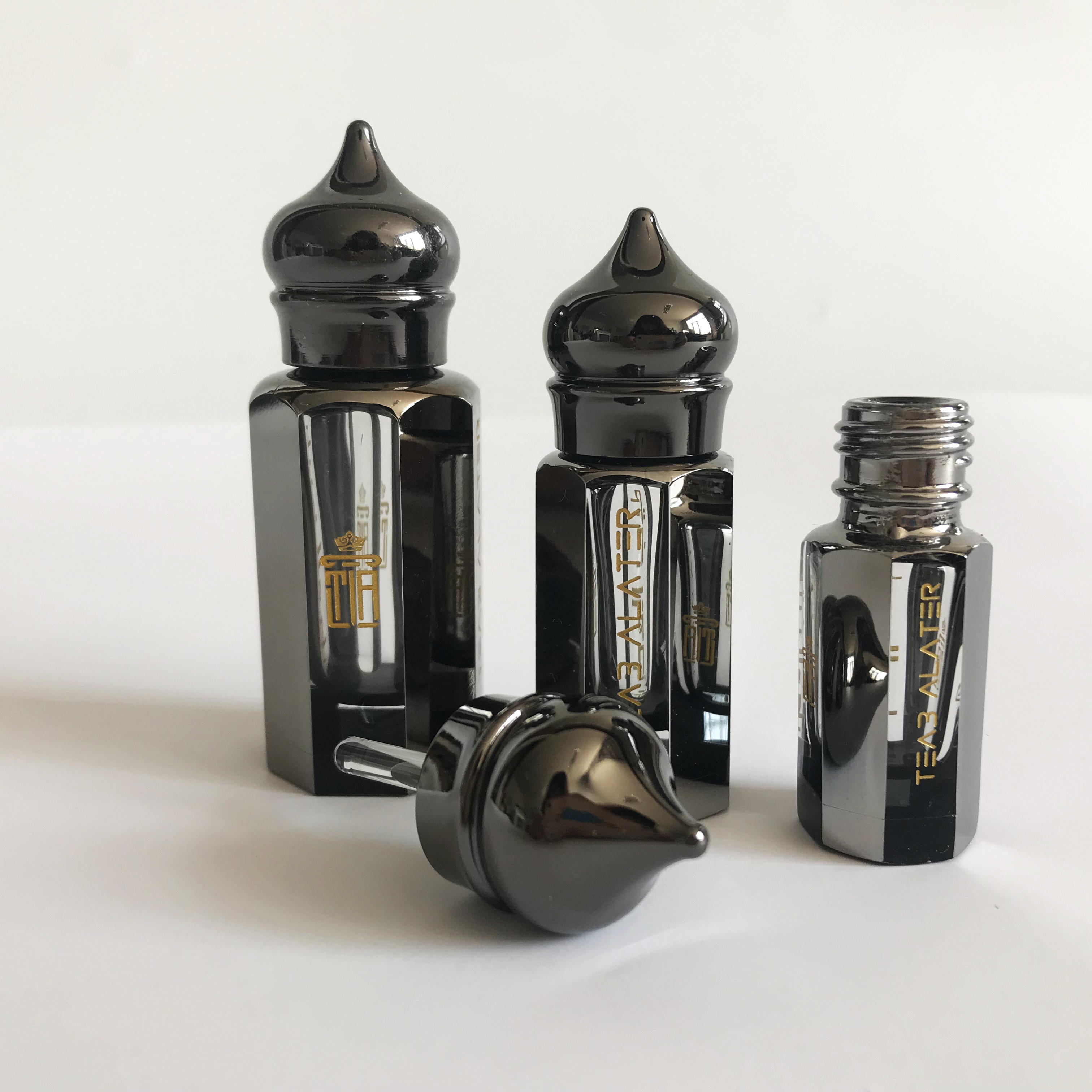 Luxury black coated octagonal shape arabian attar oud essential oil glass bottle with super metal lids and glass stick