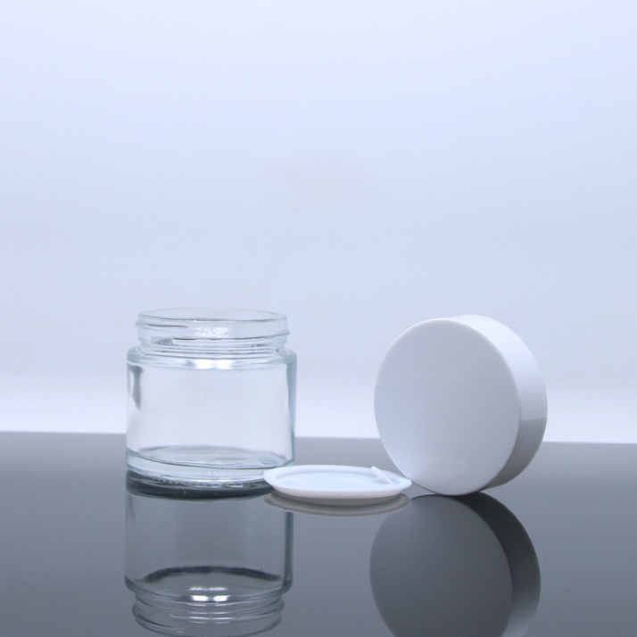 Luxury cosmetic cream glass container clear frosted glass packaging custom 2oz 60g glass jars with sealed silver aluminium lid