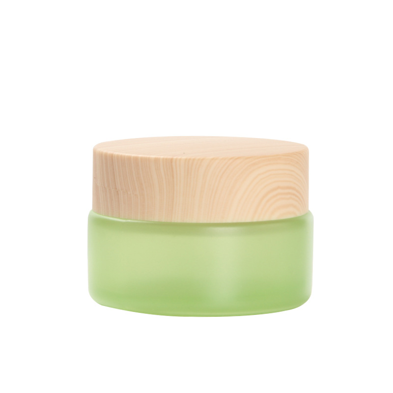 Luxury cosmetic packing frosted green 50ml glass cream jar with black cap 50g