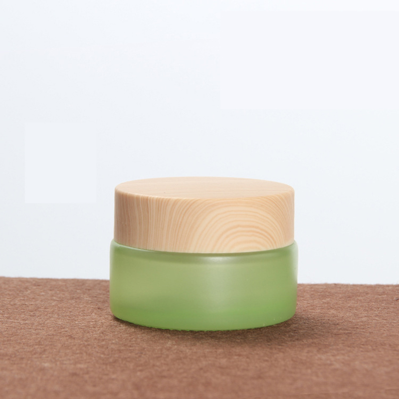 Luxury cosmetic packing frosted green 50ml glass cream jar with black cap 50g