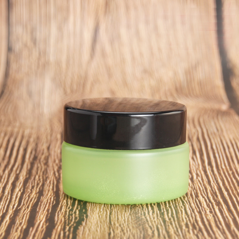 Luxury cosmetic packing frosted green 50ml glass cream jar with black cap 50g