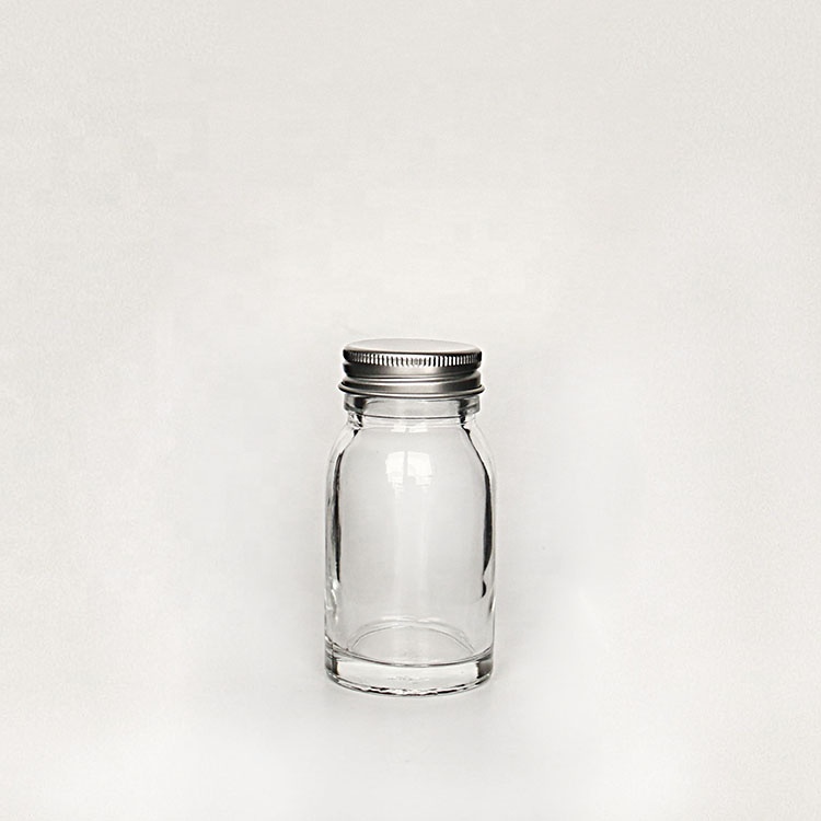 Luxury heavy base flint 50ml 100ml round empty honey sauce packaging bottles with lid wholesale