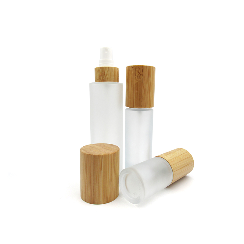 Luxury round cosmetic container clear frosted glass bottle 100ml 120ml with bamboo pump cosmetic jars 50g 100g with bamboo lid