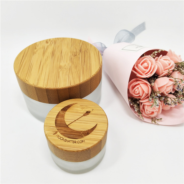 Luxury wholesale 5g 10g 15g20g 30g 50g 60g 100g cosmetic jar empty glass jars with relief logo wooden lid