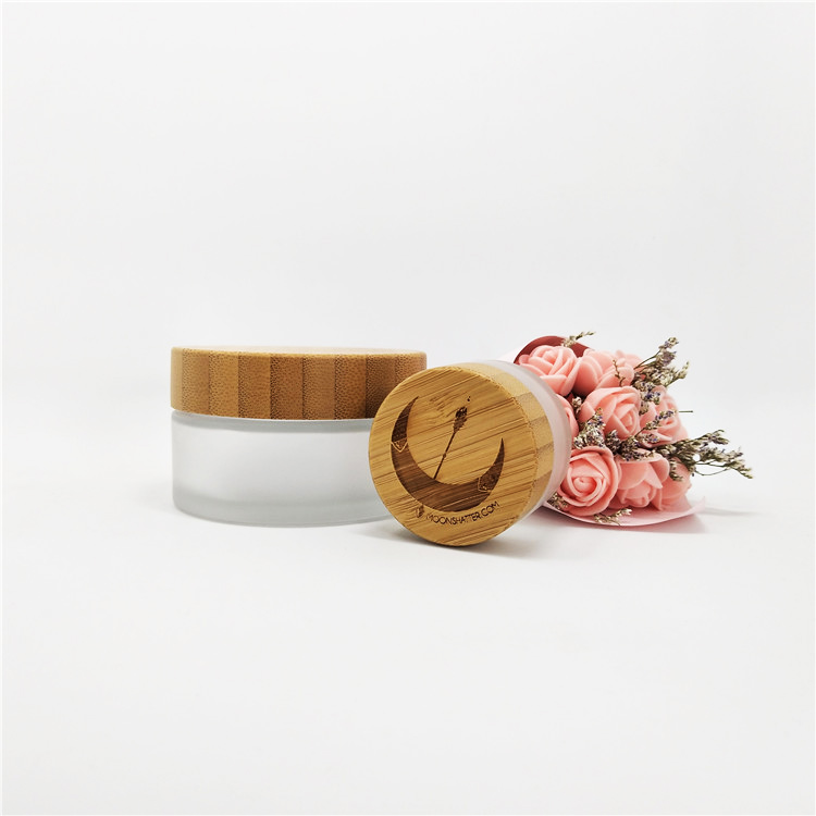 Luxury wholesale 5g 10g 15g20g 30g 50g 60g 100g cosmetic jar empty glass jars with relief logo wooden lid