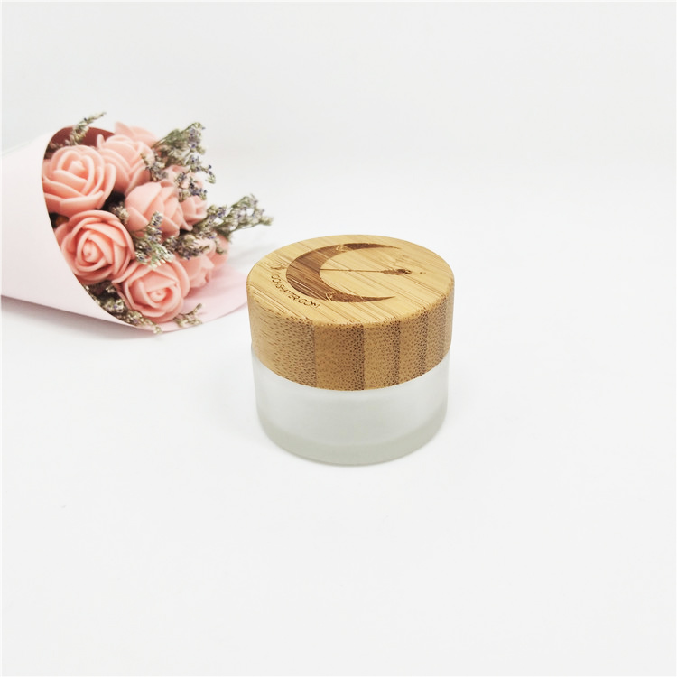 Luxury wholesale 5g 10g 15g20g 30g 50g 60g 100g cosmetic jar empty glass jars with relief logo wooden lid