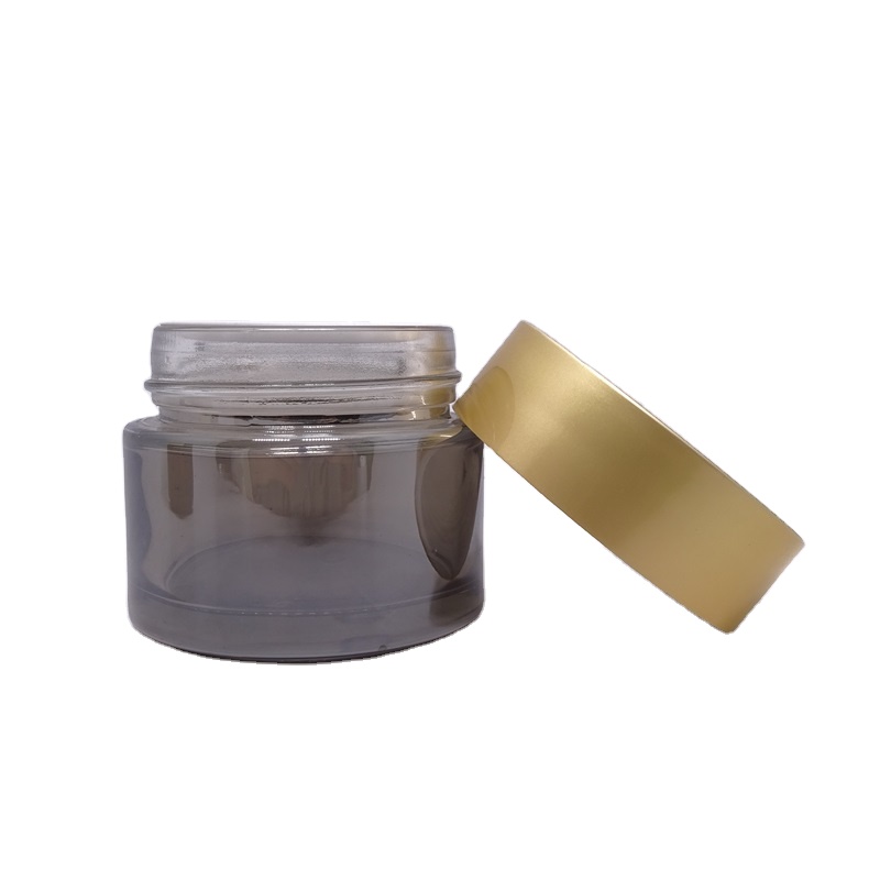 Luxury wholesale 5g 10g 20g 30g 50g 60g 100g 200g transparent black skincare cream empty glass jars with gold lid