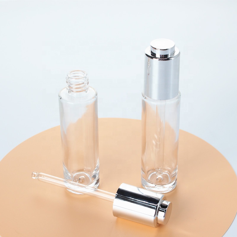 Manufacturer Direct Supply Cylinder Shape Silver Lid Pressed Pump Glass Dropper 30ml Empty Glass Serum Bottle