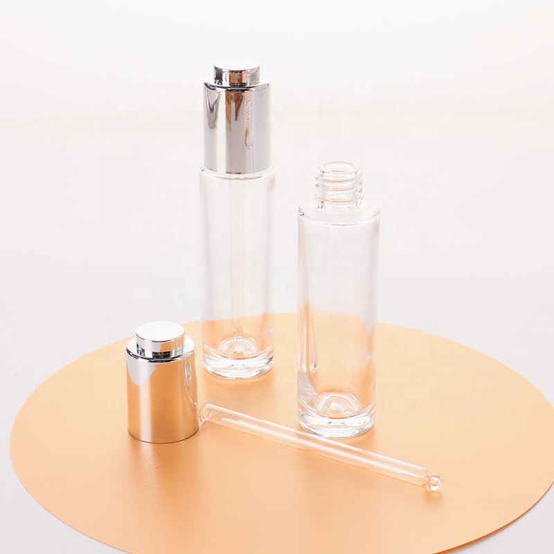 Manufacturer Direct Supply Cylinder Shape Silver Lid Pressed Pump Glass Dropper 30ml Empty Glass Serum Bottle