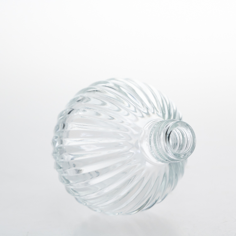 Manufacturer Perfume Bottles 50ml Round Ball Embossed Crystal Perfume Glass Bottle with Pump Spray
