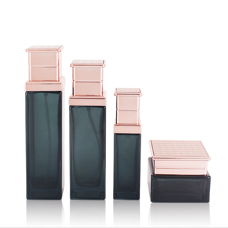 Manufacturers selling black transparent glass bottle rose gold electroplated aluminum bottle cap vacuum emulsion bottle