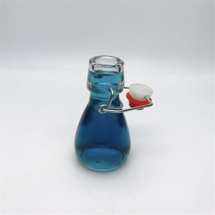 Mini 50ml 2oz swing top glass bottle for candy beverage
