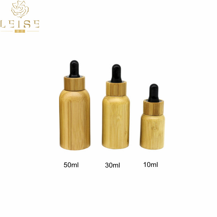 Natural 5ml 10ml 15ml bamboo roll on bottle cosmetic oil real bamboo glass roller bottle with bamboo cap metal roller ball