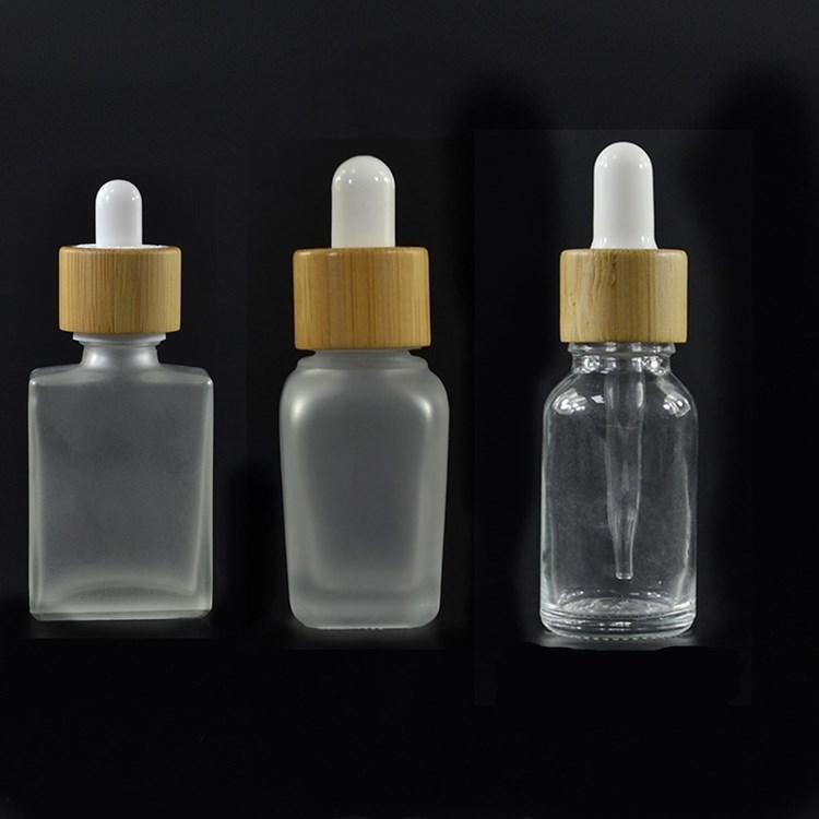 Natural bamboo cap package cylinder square rectangular 30ml 50ml 100ml glass essential oil bottle with dropper