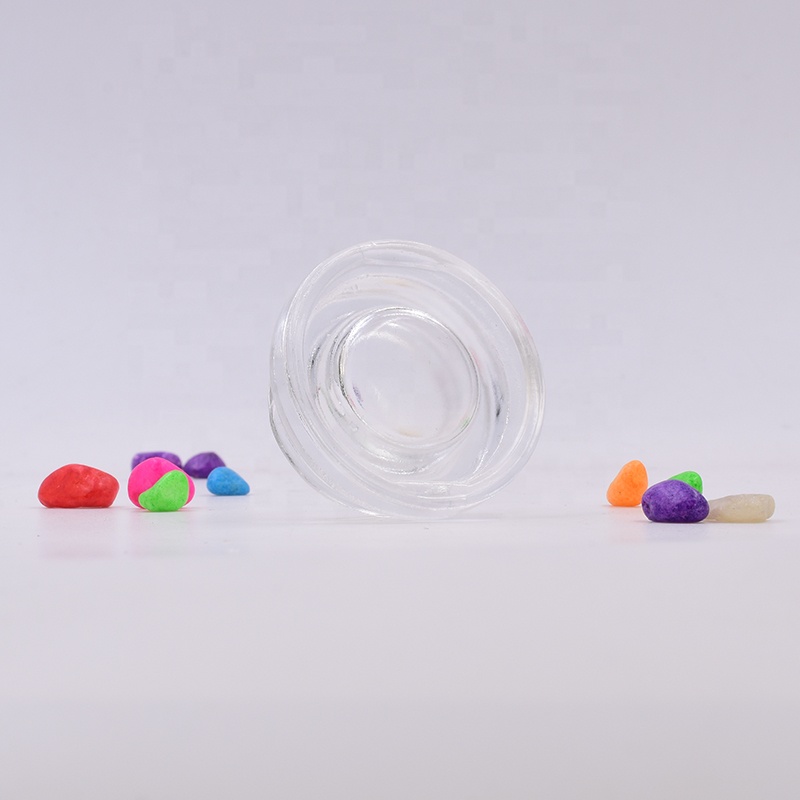 New 9 ml clear round small straight side eye cream cosmetic packing glass jar with black plastic child proof lid.