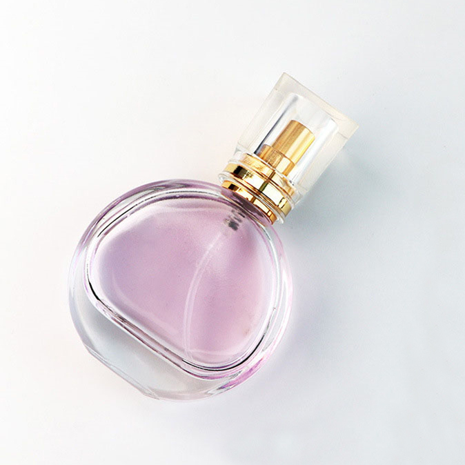 New arrival Luxury 30ml portable round transparent fragrance pump perfume glass bottle with acrylic cap
