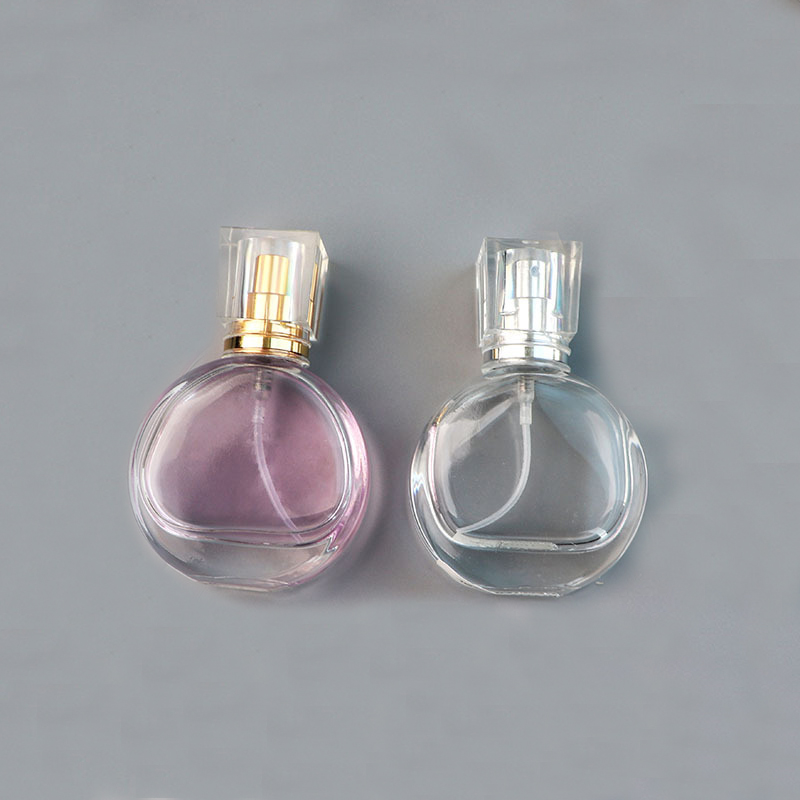 New arrival Luxury 30ml portable round transparent fragrance pump perfume glass bottle with acrylic cap