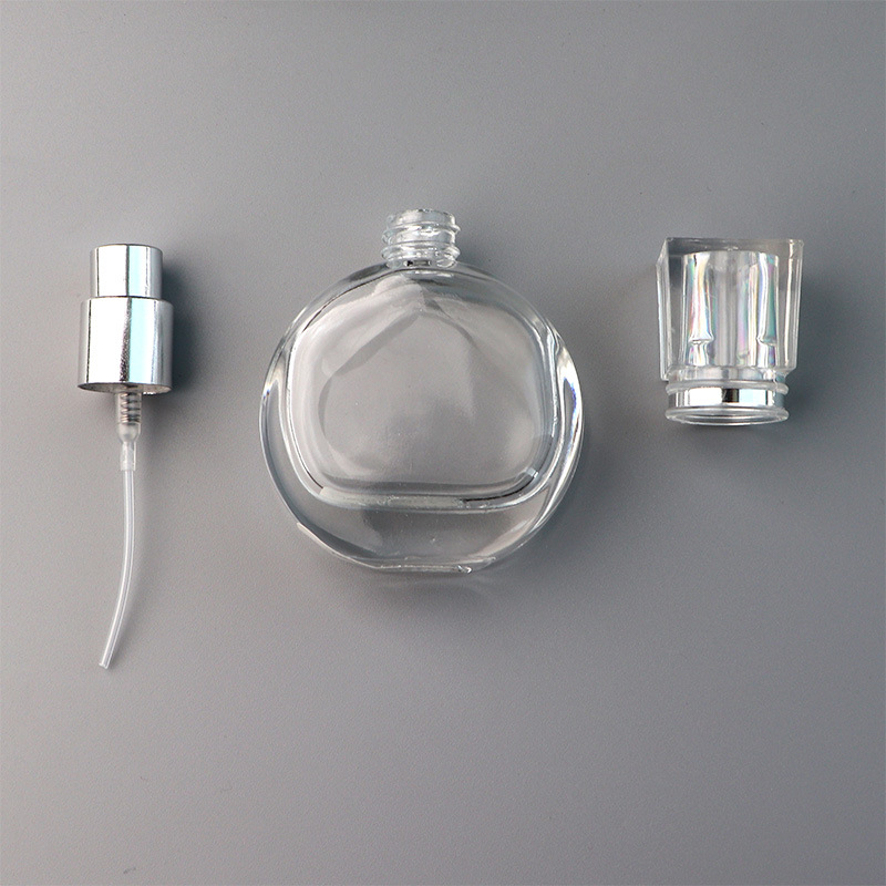 New arrival Luxury 30ml portable round transparent fragrance pump perfume glass bottle with acrylic cap
