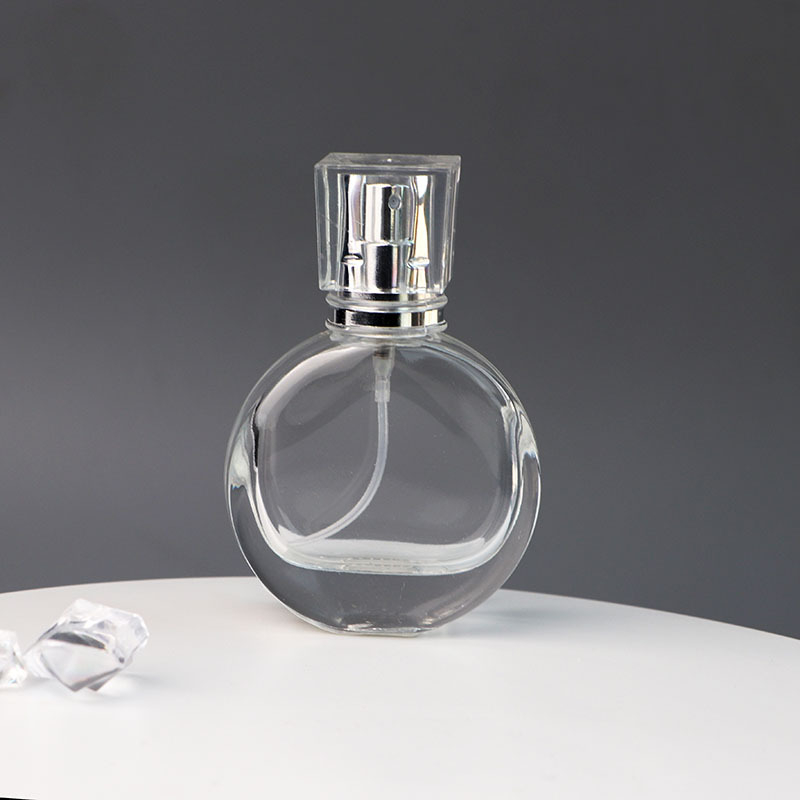 New arrival Luxury 30ml portable round transparent fragrance pump perfume glass bottle with acrylic cap