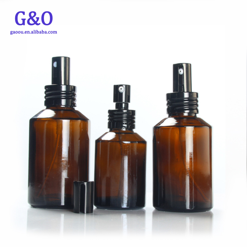 New cheap 50g 100g spray Amber glass essential oil empty cosmetic clear bottle gold silver lid cream jar