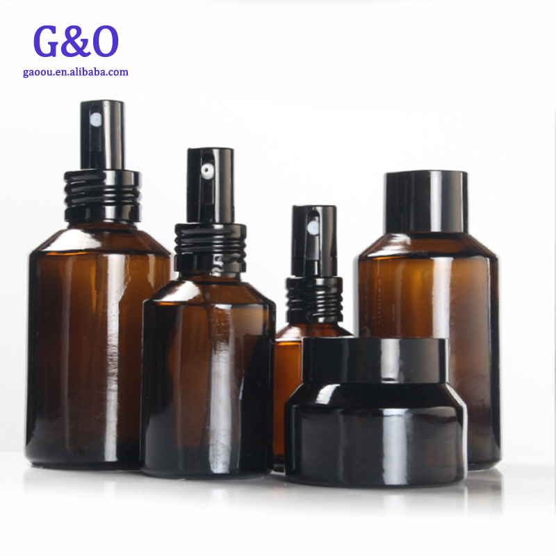 New cheap 50g 100g spray Amber glass essential oil empty cosmetic clear bottle gold silver lid cream jar
