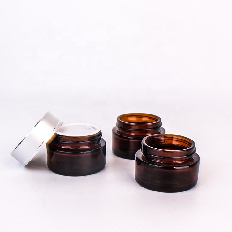 New design 20g Amber color round glass jar cream container with silver cap