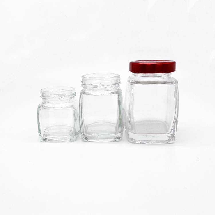 New design high quality 50ml 100ml 200ml clear square glass jar with metal lid for honey jam bird nest