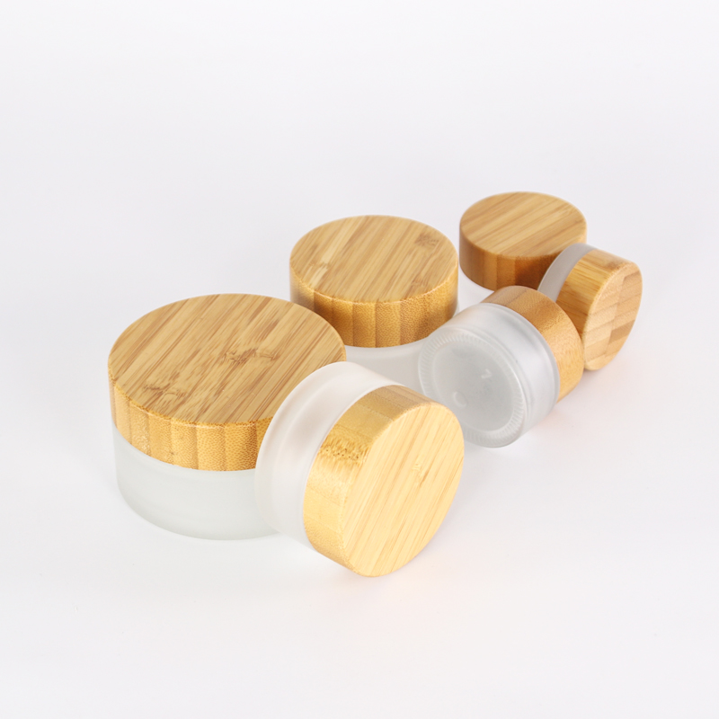 New packaging eco friendly 5ml 15ml 30ml 50ml 100ml frosted bamboo jar bamboo cosmetic jars glass jars with wood lid