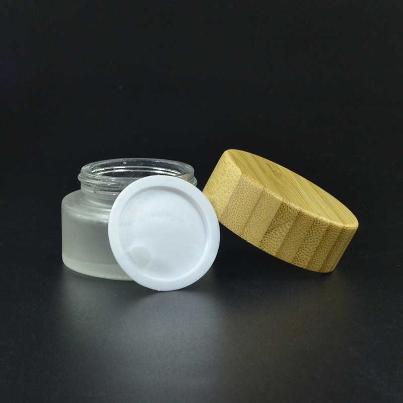 New product wholesale empty 5g 15g 30g 50g 100g cosmetic face cream frosted clear glass jar bamboo cap