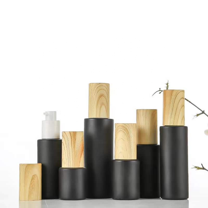 New style 5ml 10ml 15ml 20ml 30ml 50ml 80ml 100m Round Shape Matte Black Essential Oil Glass Bottle with Bamboo spray pump