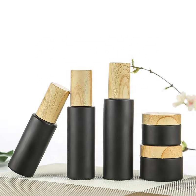 New style 5ml 10ml 15ml 20ml 30ml 50ml 80ml 100m Round Shape Matte Black Essential Oil Glass Bottle with Bamboo spray pump