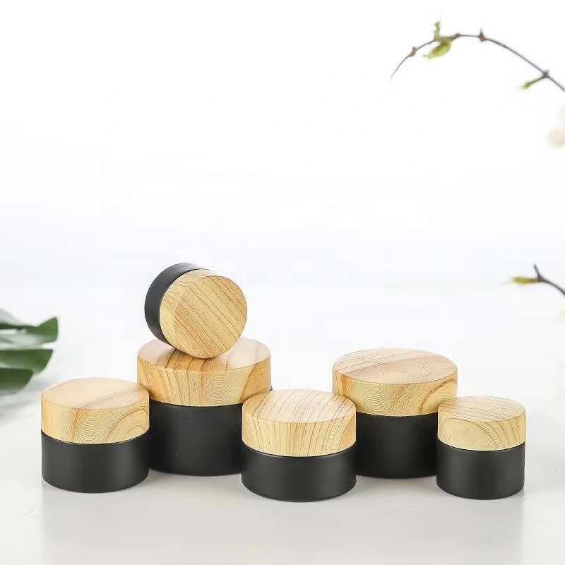 New style 5ml 10ml 15ml 20ml 30ml 50ml 80ml 100m Round Shape Matte Black Essential Oil Glass Bottle with Bamboo spray pump