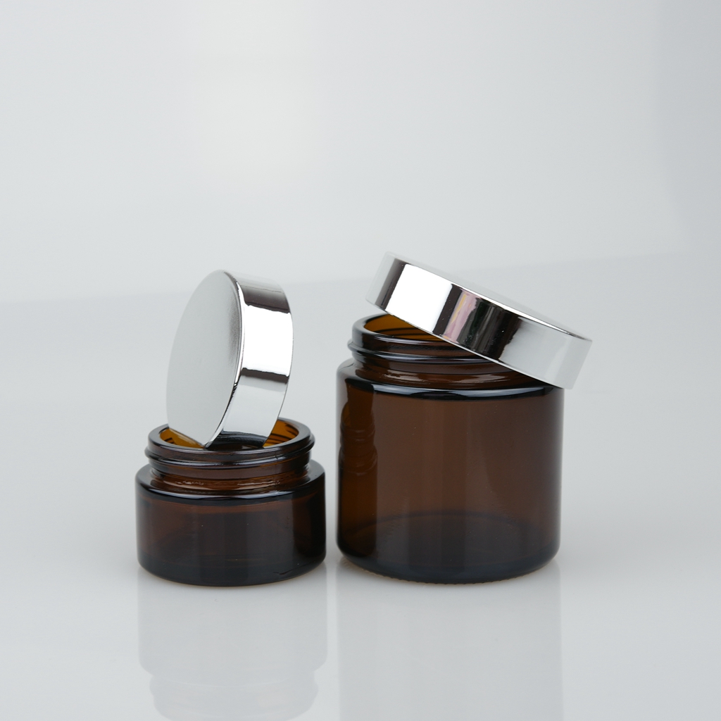 OEM 20ml 30ml 50ml 100ml clear amber cosmetic cream glass jar with gold and silver lid