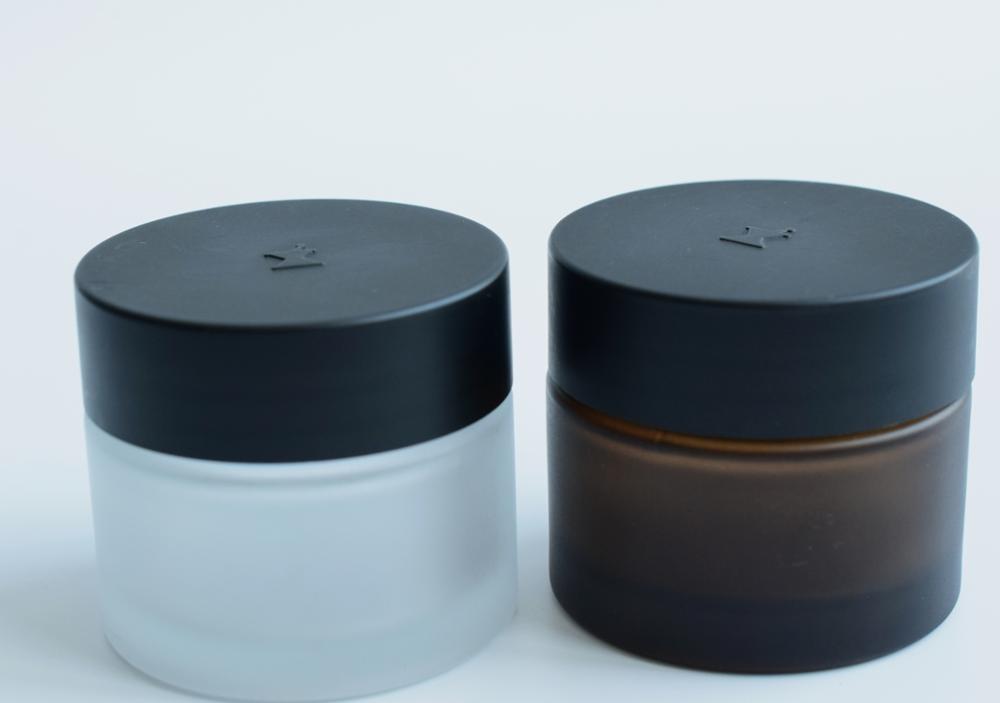 OEM 2oz 3oz Wholesale Clear Cosmetic Packaging 60ml Cream Glass Jar With Black Lid Child Resistant Lid Custom Printing