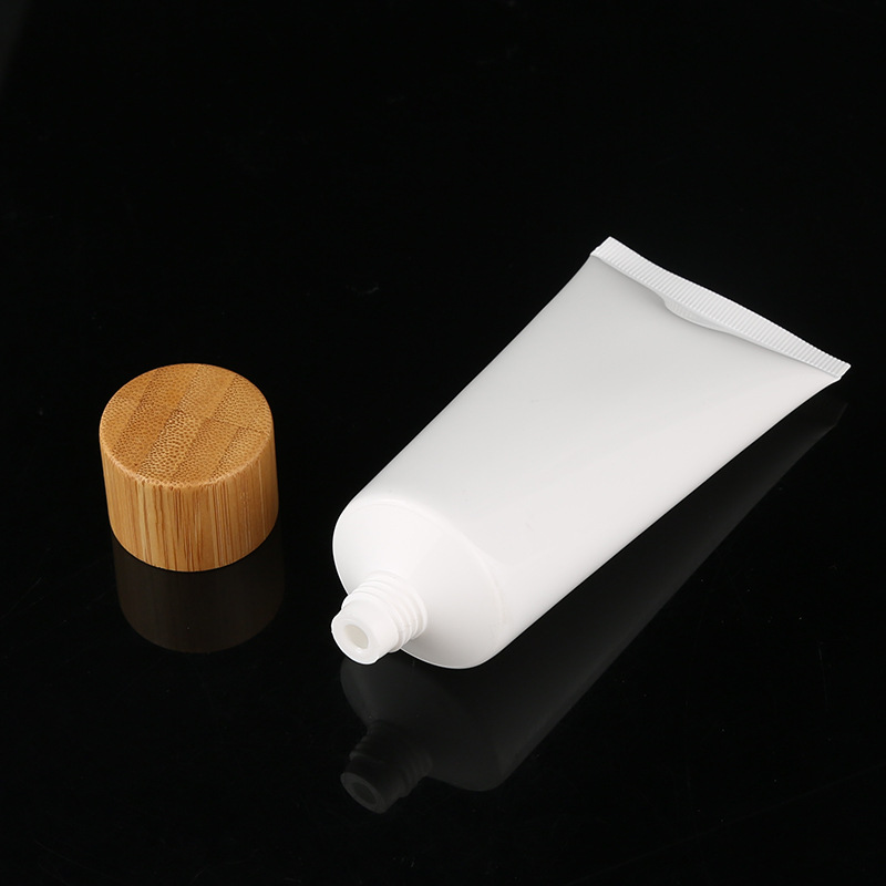 OEM 50g 100g 120g 150g white plastic PET PP bamboo lid soft tube cosmetic packaging facial cleanser