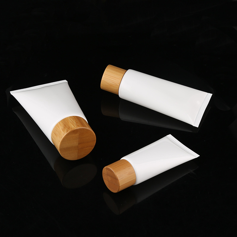 OEM 50g 100g 120g 150g white plastic PET PP bamboo lid soft tube cosmetic packaging facial cleanser