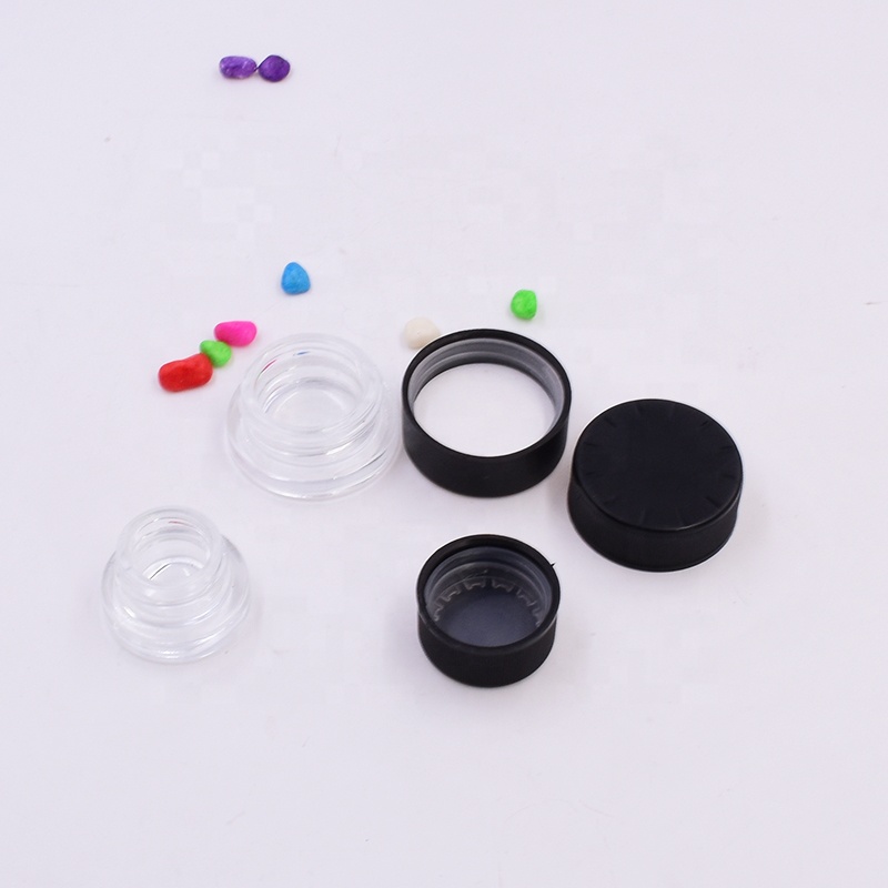 OEM 9 ml clear round small straight side eye cream cosmetic packing glass jar with black plastic child proof lid.