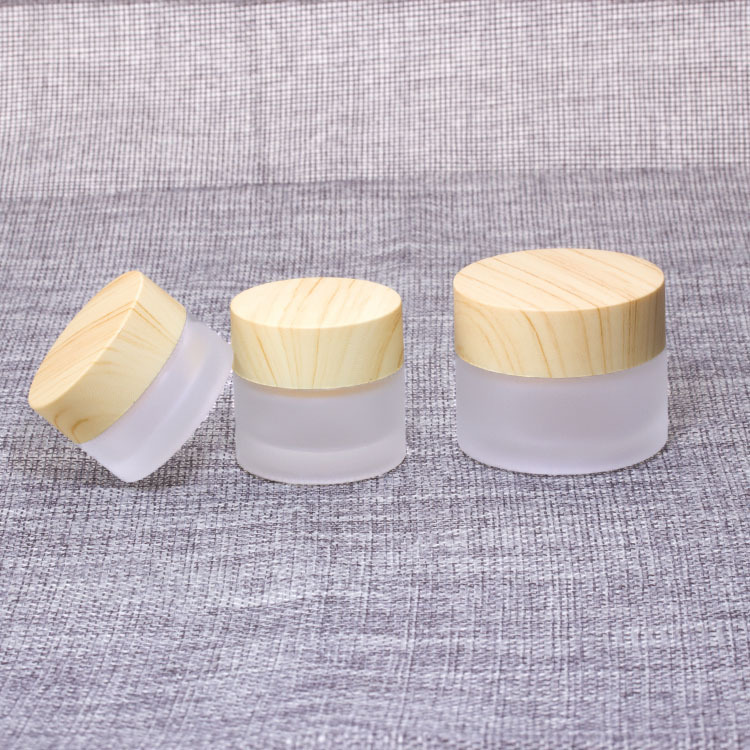 OEM ODM Cosmetic 5ml 15ml 30ml 50ml 100ml clear frosted glass jar with bamboo wooden lid for body cream